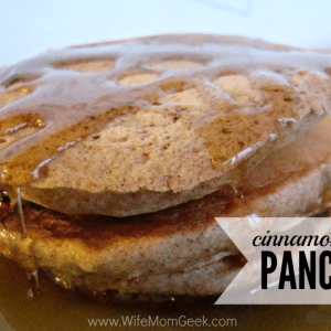stack of three cinnamon spiced pancakes covered in syrup