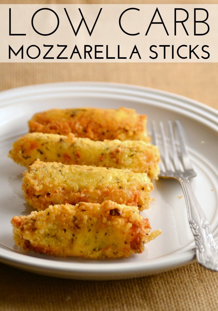 low carb mozzarella sticks on a white plate with a fork