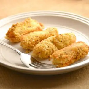 low carb cheesesticks on white plate