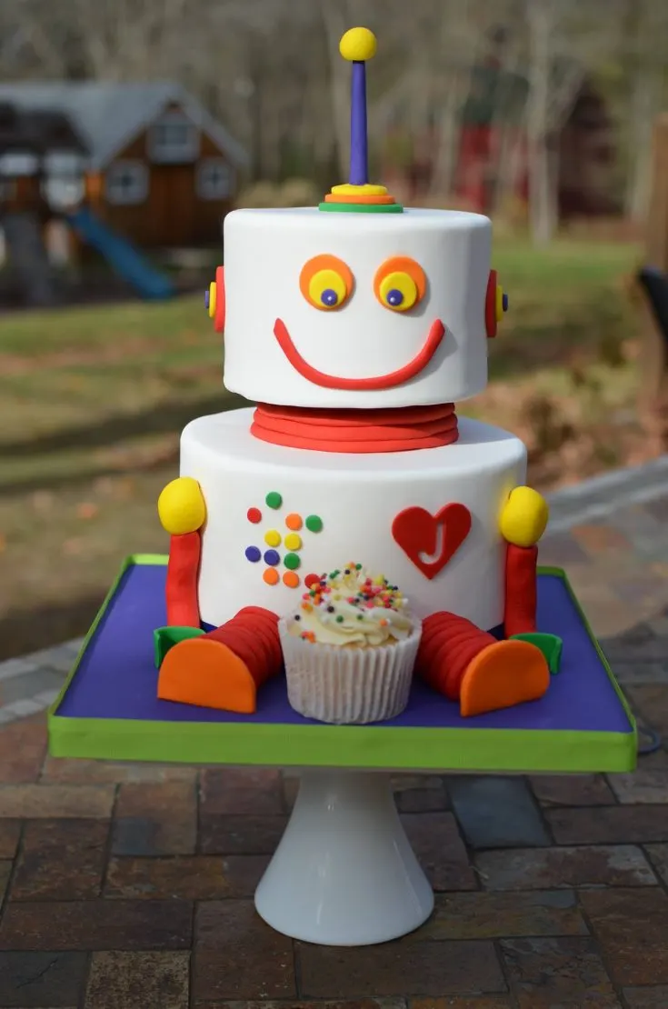 One robot sharing birthday cake with another robot, in a garden, painted by  eric joyner on Craiyon