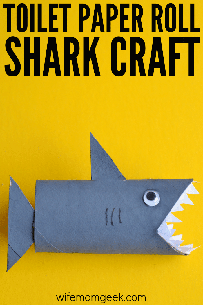 shark toilet paper roll craft on yellow background