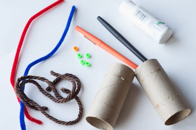 materials for the snowman craft on a white background