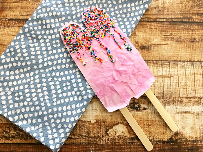 popsicle craft made with a paper plate
