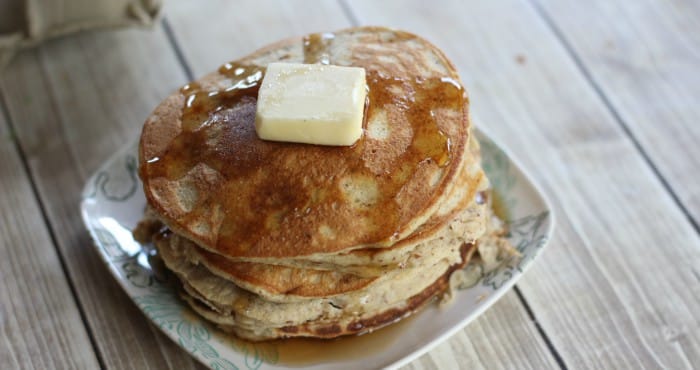 stack of low carb pancakes with a pat of butter and sugar free syrup