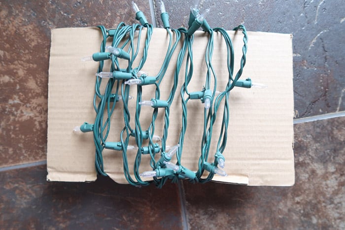 Wrap Christmas lights around cardboard to make them easier to unravel next year.