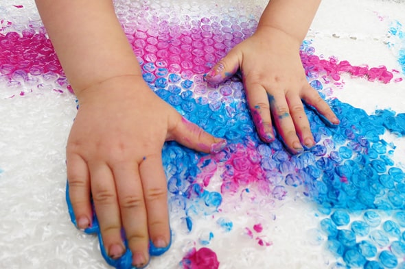 finger painting on bubble wrap