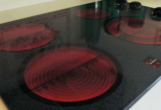 glass stove top with all burners on