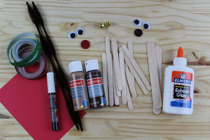 craft supplies to make a popsicle stick reindeer ornament