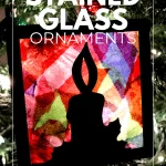 stained glass ornament on tree in the dark