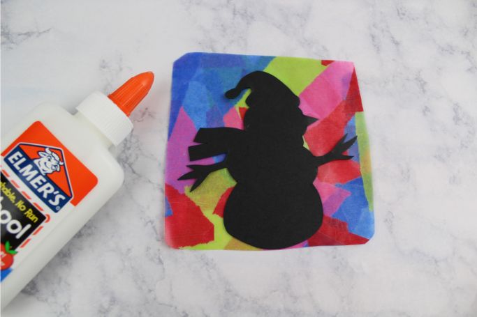 snowman silhouette glued to contact paper