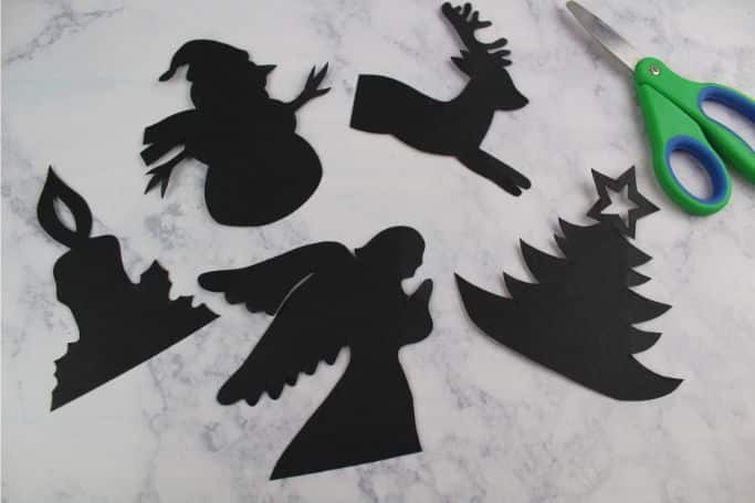 silhouette cut-outs on black cardstock