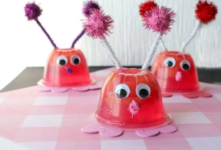 love bug snack cups on a pink checkered background