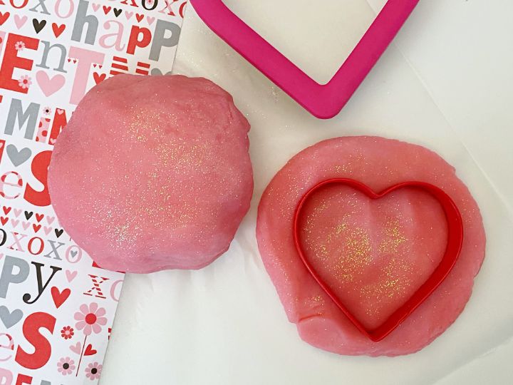 pink playdough with heart shaped cookie cutter