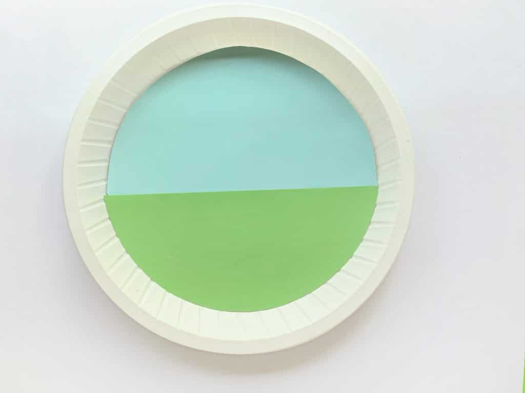 sky and grass background on paper plate