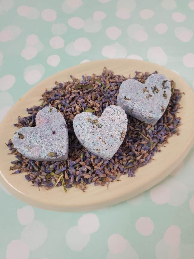 heart-shaped shower melts made with Epsom salts, lavender essential oil, dried lavender, etc.