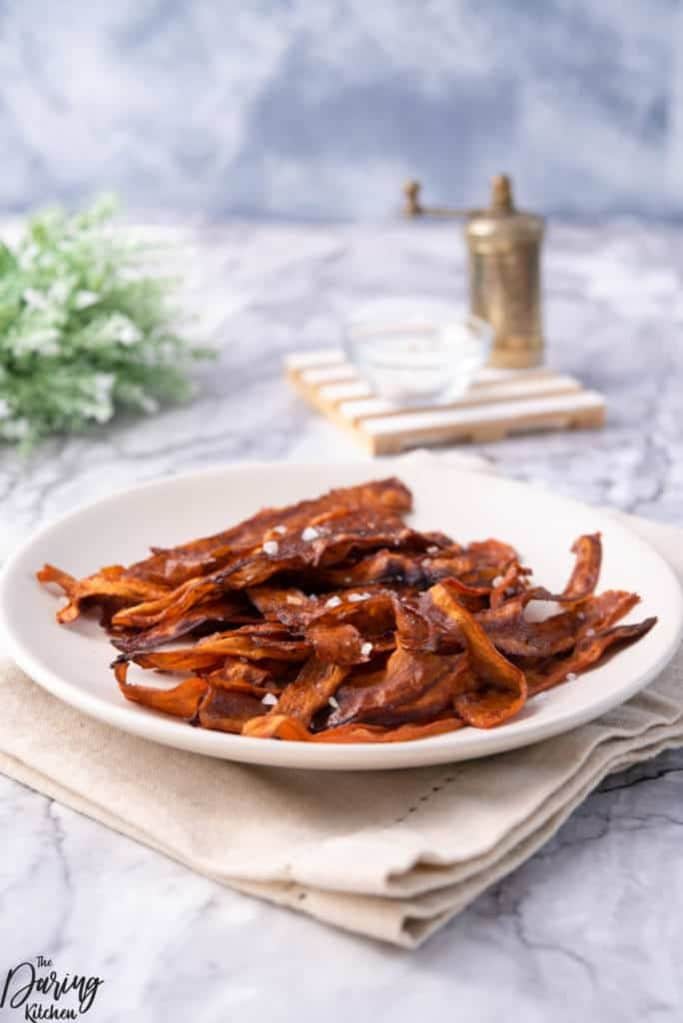 carrot bacon on a white plate