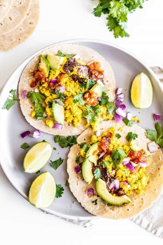 vegan breakfast tacos with lime wedges
