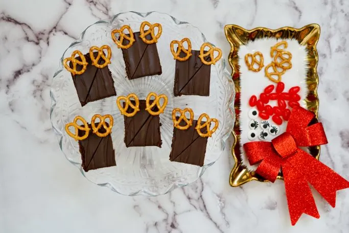 brownies are cut into rectangles with pretzel antlers in place