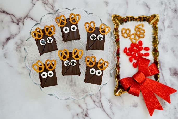 candy eyes have been placed on the Rudolph brownies