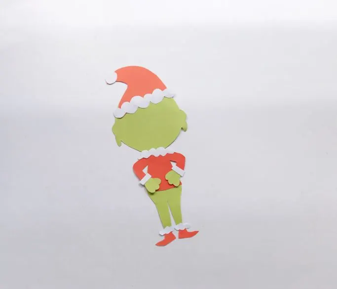 gluing the Grinch's shoes to his feet