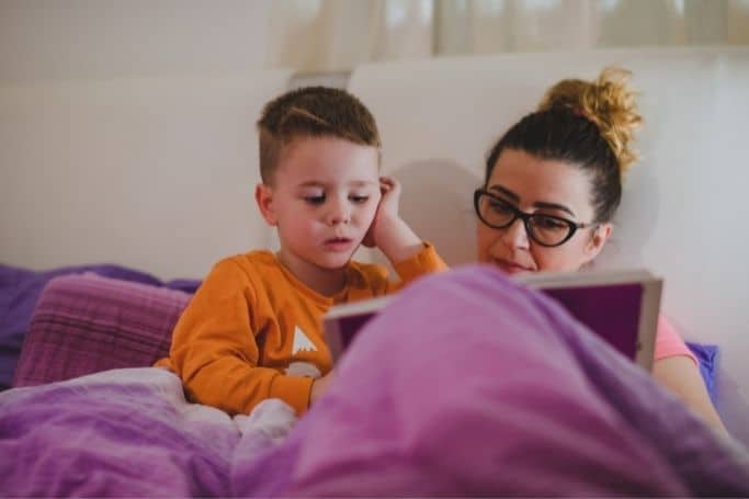 mother reading a bedtime story to her son