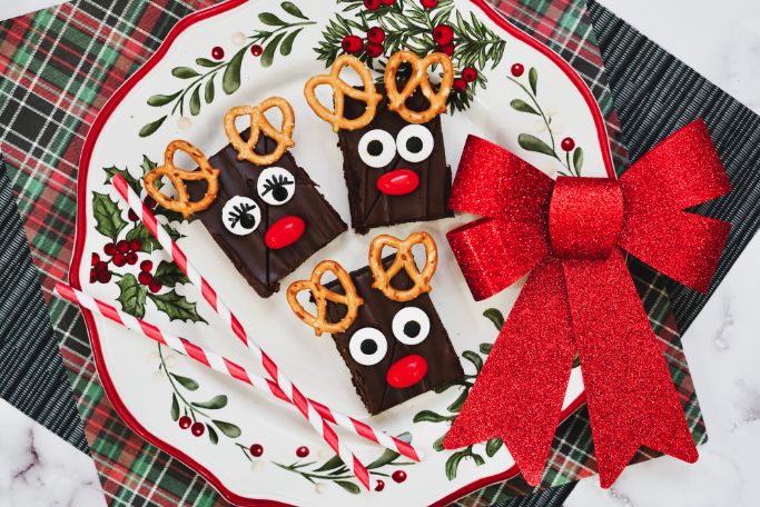 closeup of reindeer brownies on a holiday platter and plaid background