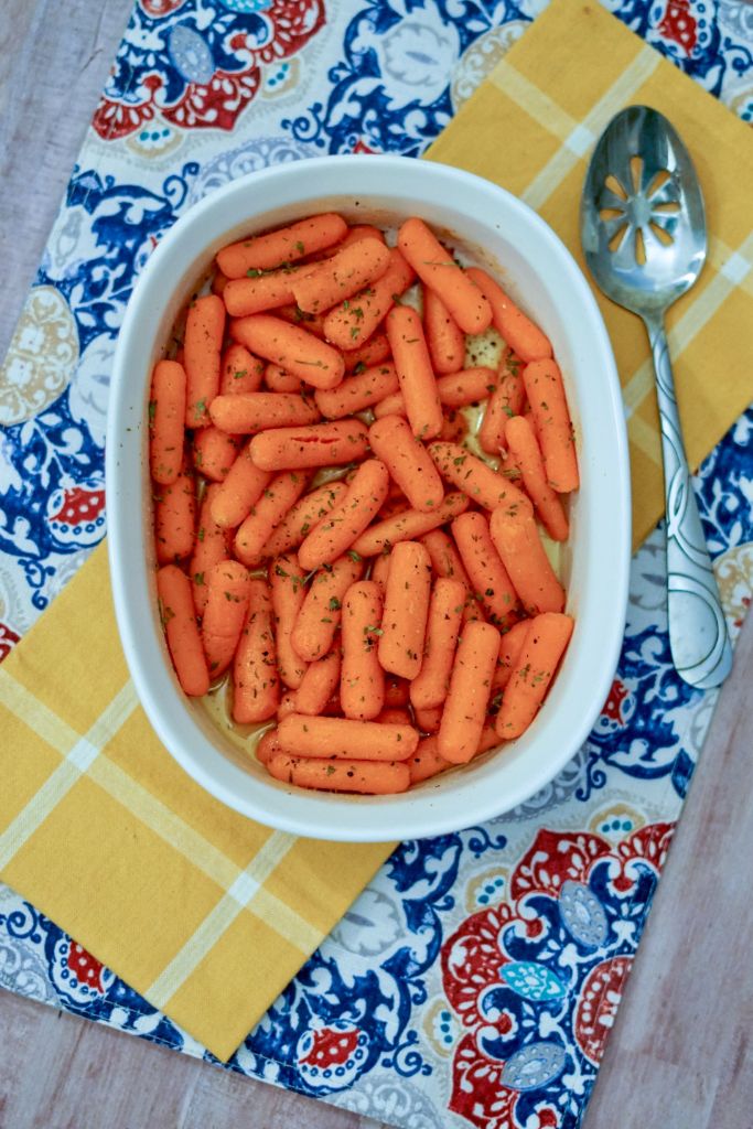 oven roasted carrots in a white baking dish