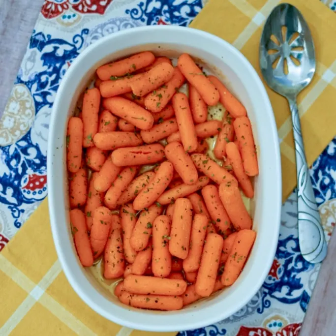 roasted baby carrots in a baking pan