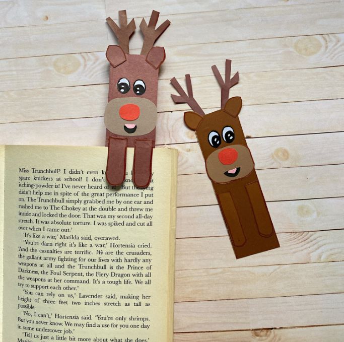 two Rudolph bookmarks with one in the book and one beside the book