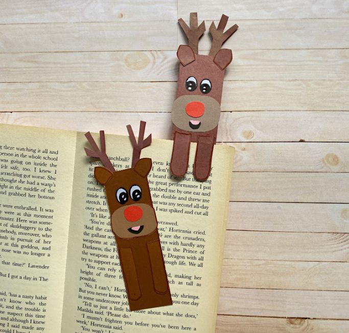 reindeer bookmarks with one on the book and one holding a page