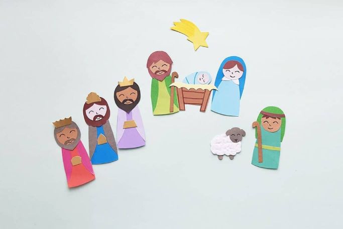 nativity scene with holy family, shepherd, wise men, and a sheep and star