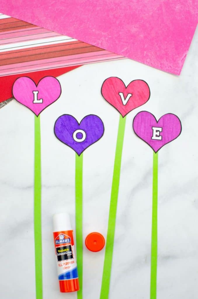 green paper stems attached to the heart flowers