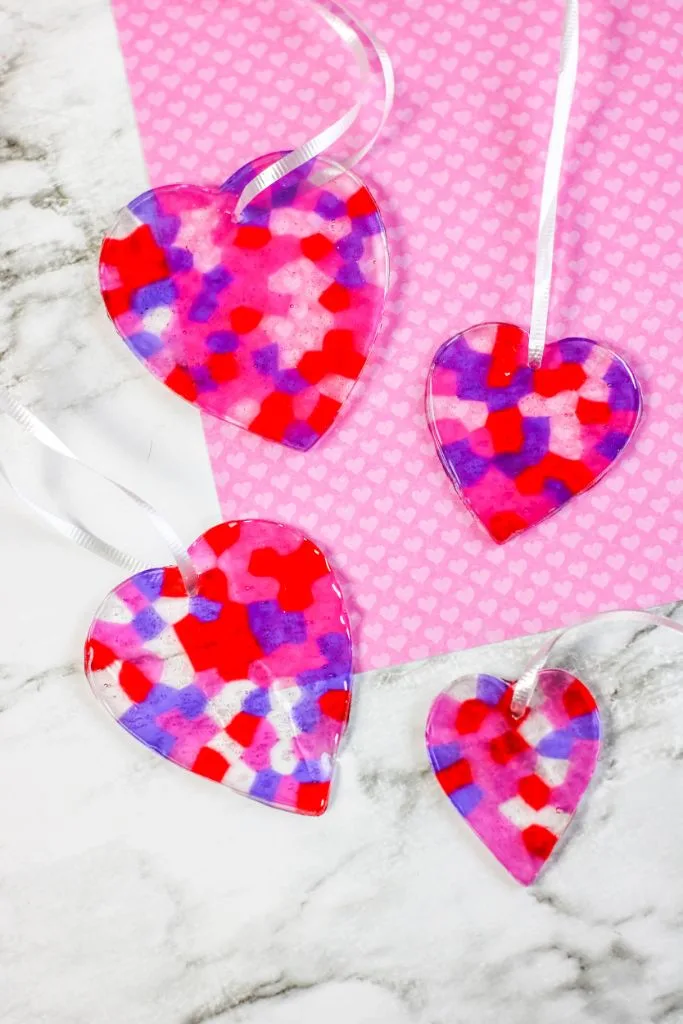 red purple and pink heart shaped suncatchers made with beads