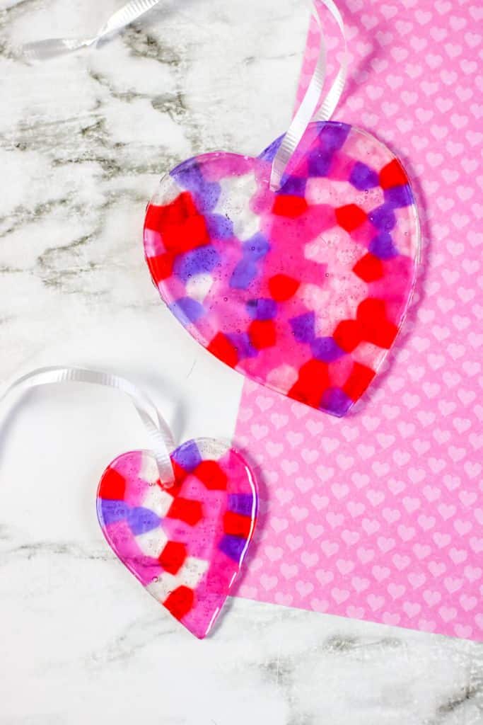large and small heart suncatchers with pink paper and marble background