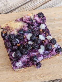 blueberry cream cheese bar on a cutting board