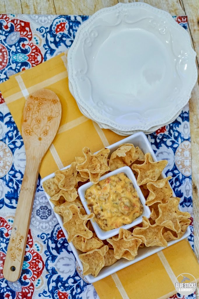 3 ingredient rotel cheese dip in serving dish with chips