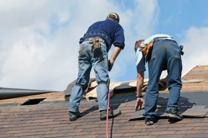 workers repairing roof