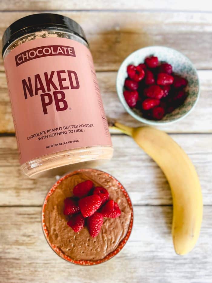 chocolate protein pudding with fresh fruit and Naked PB