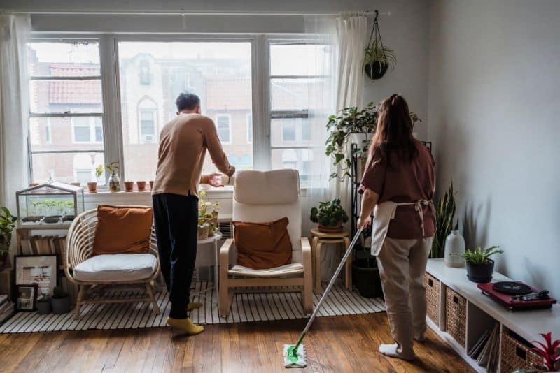 couple cleaning their home