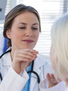 female doctor examining a patient