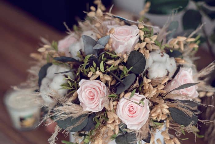 dried flower arrangement with pink roses