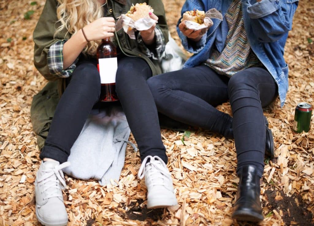 friends enjoying food and wine at a festival