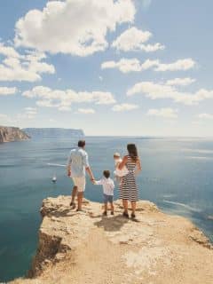 family on a seaside adventure - cliff overlooking water