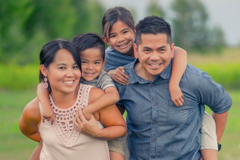 outdoor family portrait of mom, dad, son, and daughter