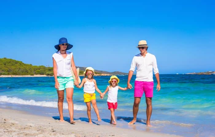 family vacationing on a beach