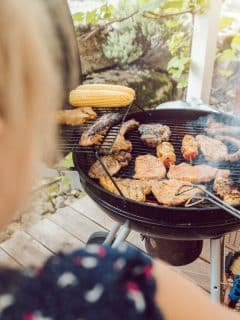 girl grilling various meats
