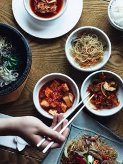 woman eating korean meal at a restaurant