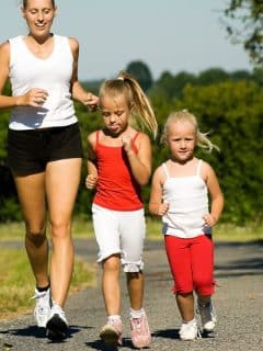 mom jogging with daughters