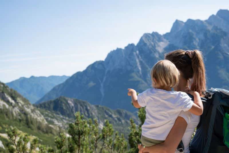 mom hiking with child