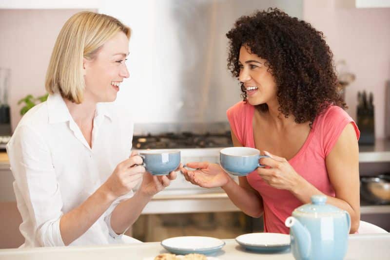 two moms enjoying coffee together